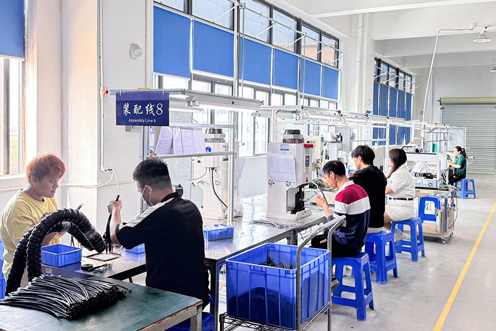 Operators at wire harness assembly workstations from XSD's supplied company profile